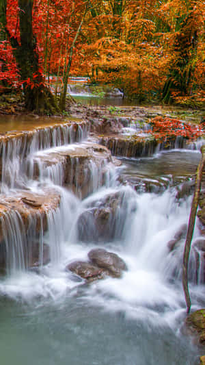 Enjoy The Tranquillity Of An Iphone Waterfall Wallpaper