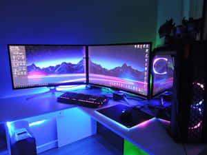 Enjoy The Ultimate Gaming Experience With This Gaming Pc Setup Wallpaper