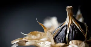 Enjoy The Unique Taste Experience Of Black Garlic Wallpaper