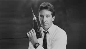 Enjoying A Break On A Matchstick, Tim Allen Strikes A Goofy Pose! Wallpaper