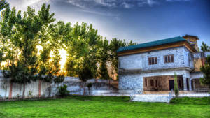 Enjoying The Beautiful Sunset On A Lush Lawn Wallpaper