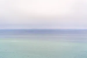 Enjoying The Natural Beauty Of An Ombre Ocean Landscape Wallpaper