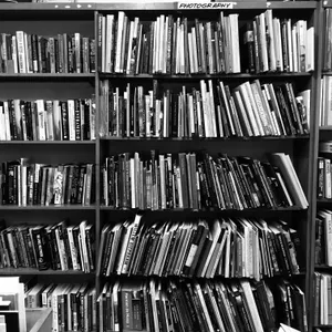Enthralling Collection Of Palpable Books On Shelves Wallpaper