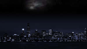 Enthralling Night View Of A Dark City Wallpaper