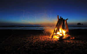 Ephemeral Moments By The Beach Bonfire Wallpaper