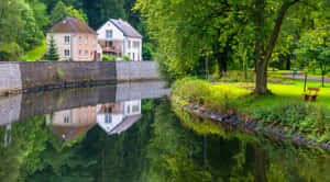 Eschsur Alzette Tranquil Riverside Scene Wallpaper