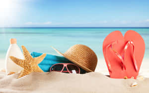 Essential Beach Accessories Ready For Some Fun In The Sun Wallpaper