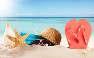 Essential Beach Accessories Ready For Some Fun In The Sun Wallpaper