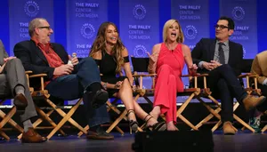 Esteemed Actor Ed O'neill Sitting On A Wooden Bench Wallpaper