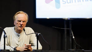 Esteemed Business Leader John Sculley Delivering Keynote Speech Wallpaper