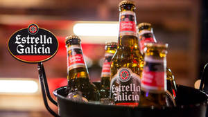 Estrella Galicia Special Beer Chilling In Cooler Bucket Wallpaper