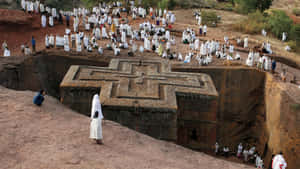 Ethiopian Orthodox Christians Praying At St. George Church In Lalibela Wallpaper