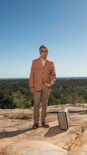 Eugene Levy In Thoughtful Stance Wallpaper