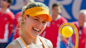 Eugenie Bouchard Smiling With Trophy Wallpaper