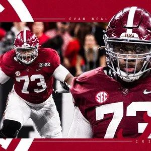 Evan Neal In Action - Promising Talent On Field Wallpaper