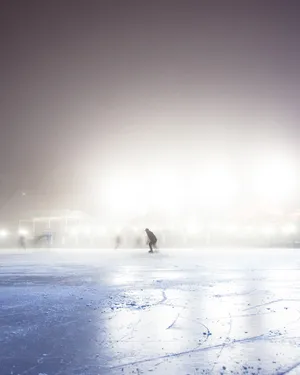 Evening Ice Rink Under Starry Sky Wallpaper