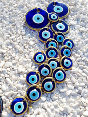 Evil Eye Amuletson White Stones Wallpaper