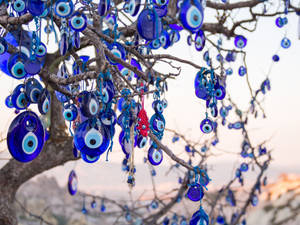 Evil Eye Hanging On Tree Wallpaper