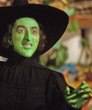 Evil Witch Conjuring Dark Magic In A Haunted Forest Wallpaper