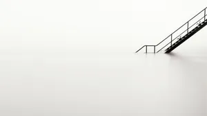 Evoking Simplicity - White Minimalist Interior With Black Staircase Wallpaper