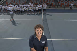 Evonne Goolagong Cawley With Young Tennis Players Wallpaper