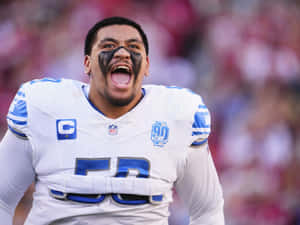 Excited Football Player Celebration Wallpaper