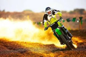 Exciting Action Shot Of Monster Dirt Bike Adventure Wallpaper