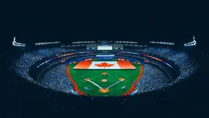 Exciting Baseball Game Under The Lights At A Modern Stadium Wallpaper