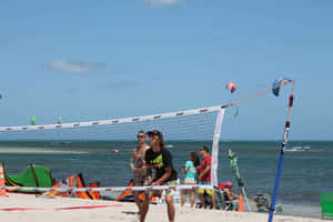 Exciting Beach Tennis Action Wallpaper