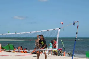 Exciting Beach Tennis Action Wallpaper
