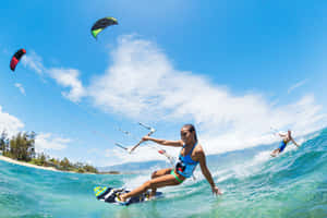 Exciting Beach Water Sports Adventure Wallpaper