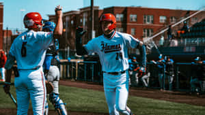 Exciting College Baseball Game Moment Wallpaper