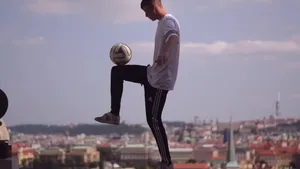 Exciting Freestyle Soccer Trick Performance Wallpaper