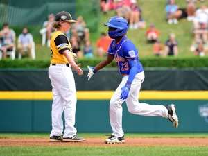 Exciting Little League Baseball Game Moment Wallpaper