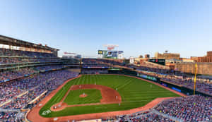 Exciting Night Game At Baseball Stadium Wallpaper