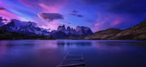 Exciting Outdoor Landscape With Green Rolling Hills And Vibrant Blue Skies Wallpaper