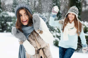 Exciting Snowball Fight Among Friends Wallpaper