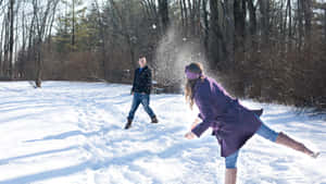 Exciting Winter Snowball Fight Wallpaper