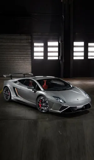 Exclusive Lamborghini Iphone Silver Edition In A Luxurious Garage Wallpaper