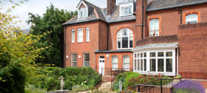 Exeter Traditional Red Brick House Wallpaper