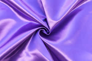 Experience Luxurious Glamor With This Gorgeous Purple Satin Wallpaper Wallpaper