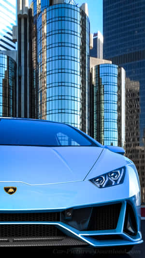 Experience Luxury And Speed With This Blue Lamborghini Iphone Wallpaper