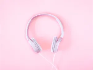 Experience The Beauty Of Music With Our Pink Headphones. Wallpaper