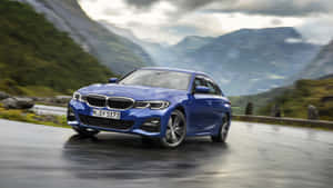 Experience The Bmw 328 - Luxury Redefined Wallpaper