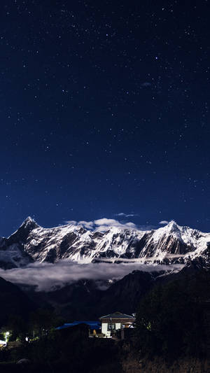 Experience The Majestic Night Mountain Wallpaper