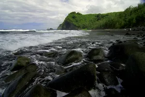 Experience The Peaceful Beauty Of A Black Sand Beach Wallpaper