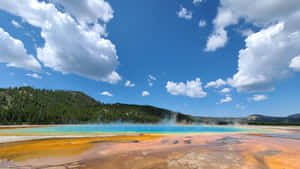 Experience The Power Of Old Faithful Geyser In Yellowstone National Park Wallpaper