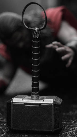 Experience The Power Of Thor's Hammer Wallpaper