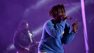 Experience The World Of Juice Wrld At His Dynamic Live Concerts Wallpaper