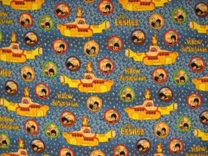 Explore The Deep Waters With A Vibrant Yellow Submarine Wallpaper
